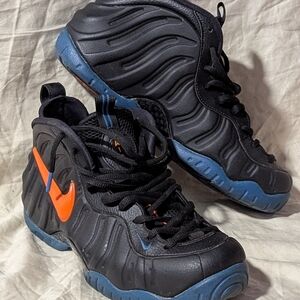 Nike Kids Black Sneakers with Orange Swoosh and Blue Sole